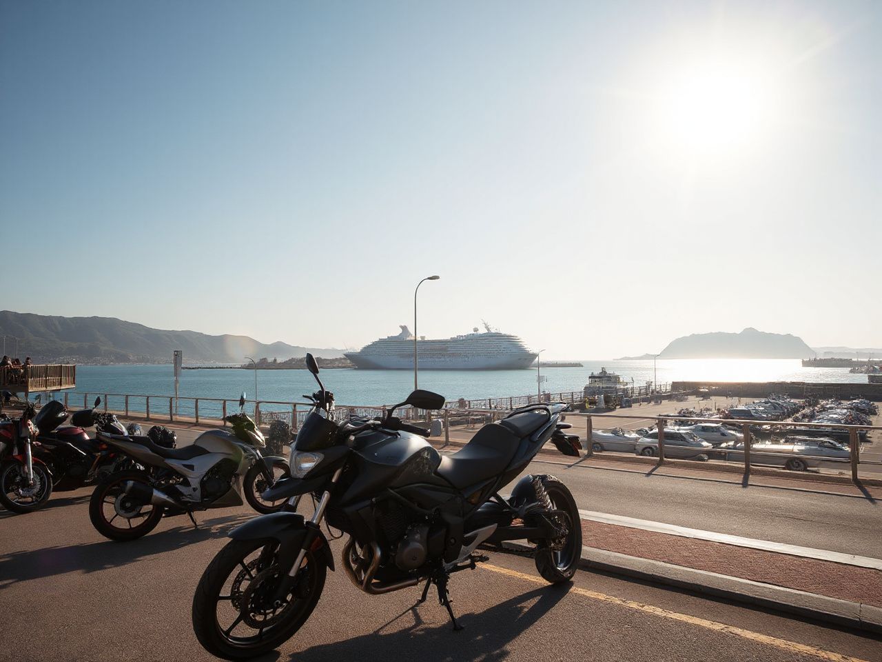 A sunlit coastal promenade with motorcycles parked near a bustling harbor and a distant cruise ship silhouette