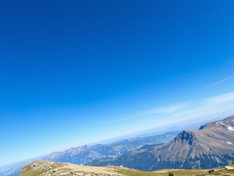 A vibrant mountain landscape with a clear blue sky, perfect for an exhilarating skydiving adventure